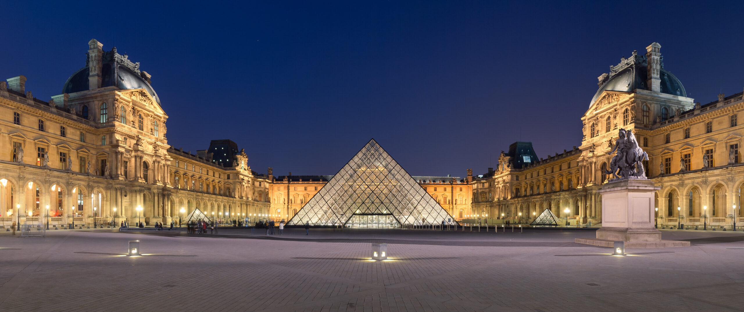 The Louvre and its glass pyramid in Paris
