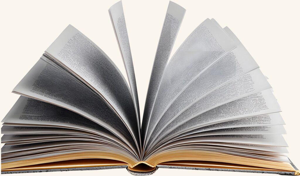 An open book fanned to show its pages, the page count you check first when you make a junk journal for a game